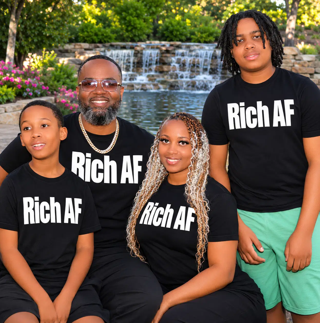Rich Thames and his three children wearing matching black Rich AF shirts